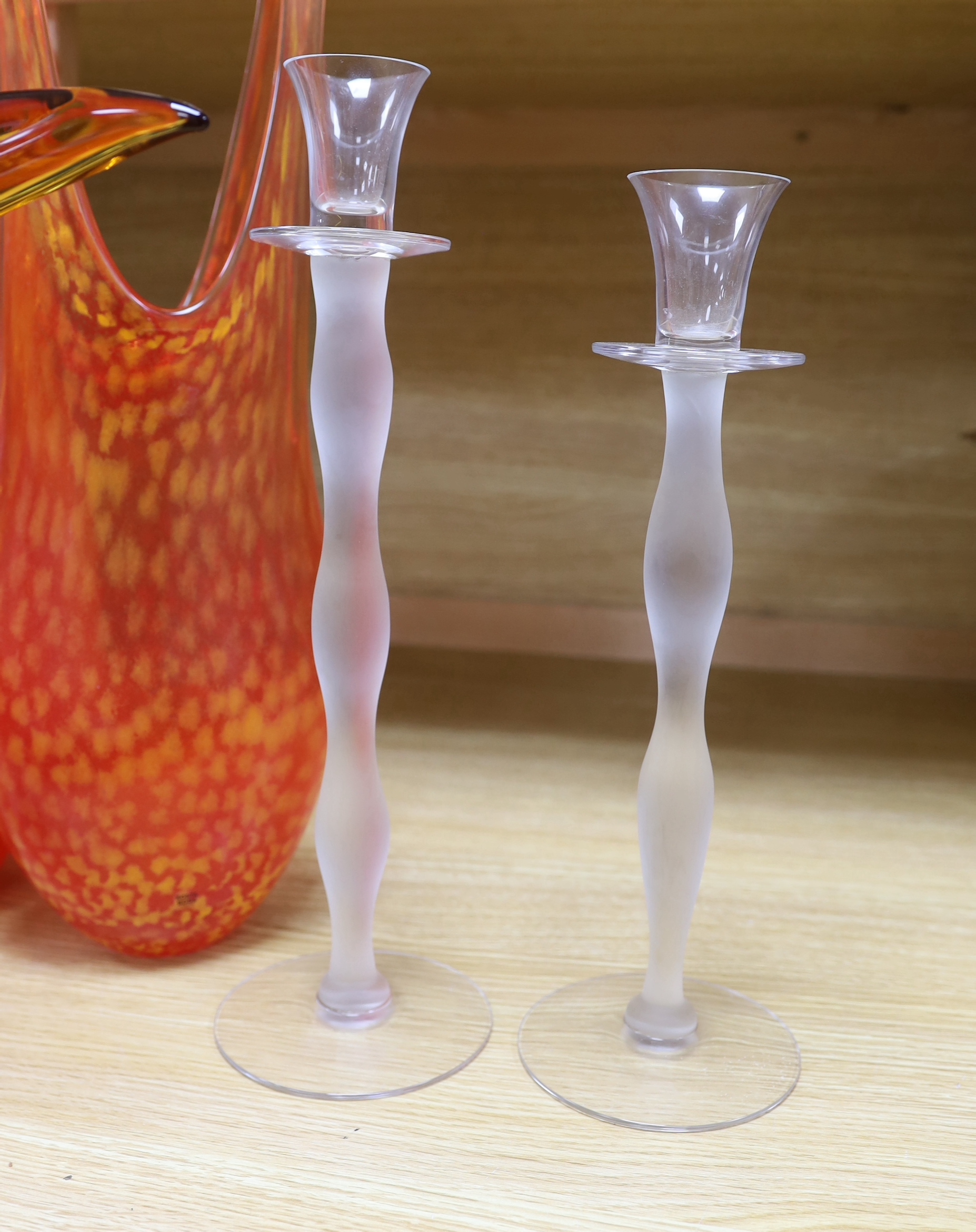 Art glassware comprising of two orange Kosta Boda glass vases, a novelty glass pelican ornament and a pair of glass candlesticks (5), the largest 47cm high